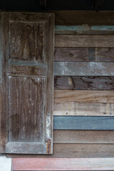 Old weathered wooden surfaces walls with longboards lined up with grain and texture for background.