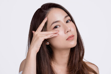 Beautiful young asian woman with natural makeup and clean skin. Face care or eye careconcept.