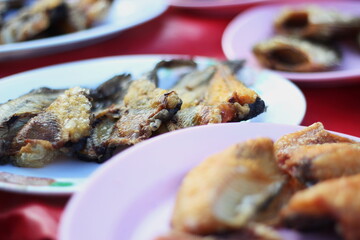 fried fish in plastic plate Sold in the market in Thailand