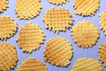 Flat lay with wafer slices on violet background