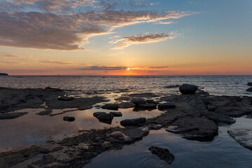 Sunset over the Baltic sea. Rocky coast in Estonia.