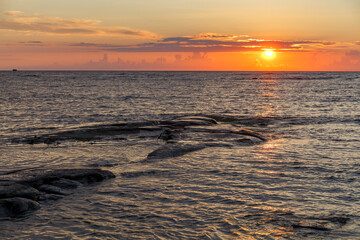 Sunset over the Baltic sea. Rocky coast in Estonia.