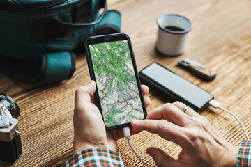 Man planning next vacation trip while journey searching travel destination and routes using...