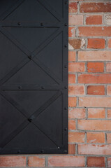 Black texture dark slate background. Red brick wall surface.