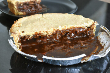 Steak pie in aluminium foil bowl. 