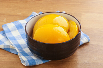Sweet canned peaches with syrope