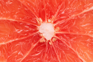 Grapefruit slice macro texture. Grapefruit citrus fruit background.