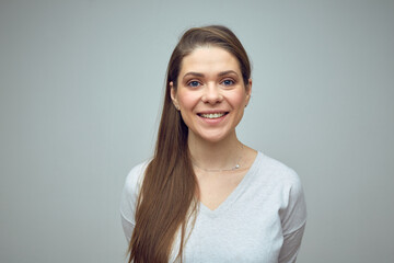 Smiling woman wearing white shirt. Isolated portrait.