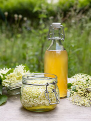 Homemade elderflower cordial syrup and lemonade.