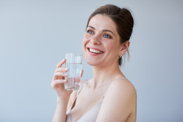 Smile woman drinking wather with naked shoulders. isolated portrait.
