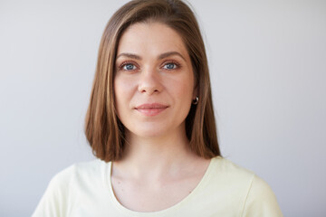 Focused thinking woman face portrait. Girl looking away. Female head shot with shallow depth of field.
