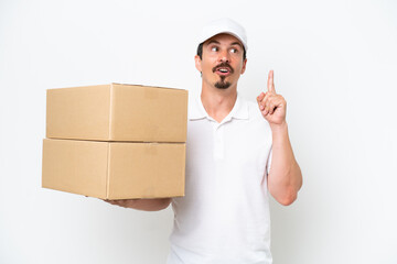 Delivery caucasian man isolated on white background thinking an idea pointing the finger up