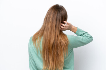 Young caucasian woman isolated on white background in back position and thinking