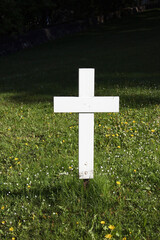 White wooden cemetery cross