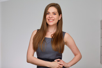 Business woman in gray business dress. Isolated portrait of smiling girl with long hair.