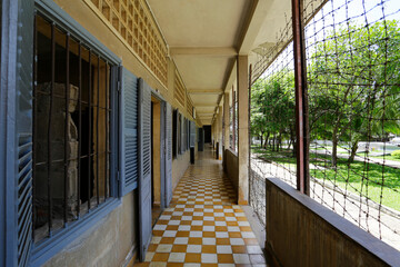 Cells used as torture chambers, left, are seen in the former Tuol Sleng S-21 prison and interrogation center of the Khmer Rouge regime, which is now a museum in Phnom Penh, Cambodia.