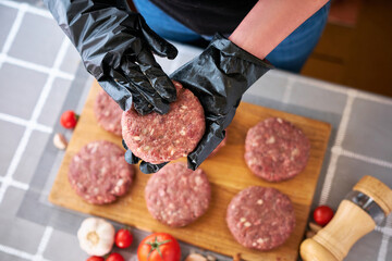 Fototapeta Making Billets for burgers from fresh minced meat on domestic kitchen obraz