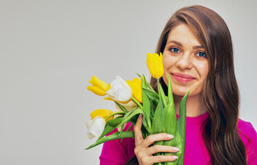 woman in red holding flowers bouquet in front of face. Isolated
