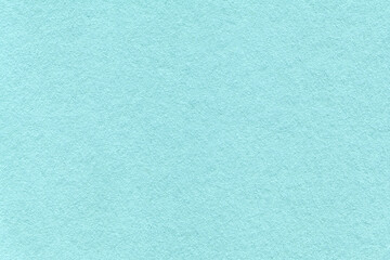 Obraz premium Texture of light blue and turquoise colors paper background, macro. Structure of dense cerulean craft cardboard.
