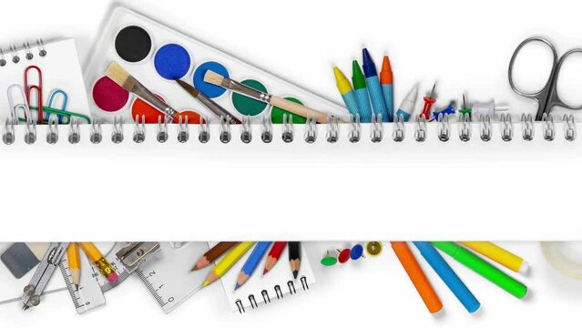 Colorful school supplies being moved underneath the blank notepad. School and Education background with white space. Seamless looping. High quality 4k video.