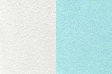 Texture of craft blue and white paper background, half two colors, macro. Structure of vintage...