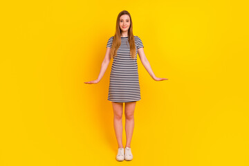 Fototapeta na wymiar Full length photo of young adorable woman good mood standing wear modern outfit isolated over yellow color background