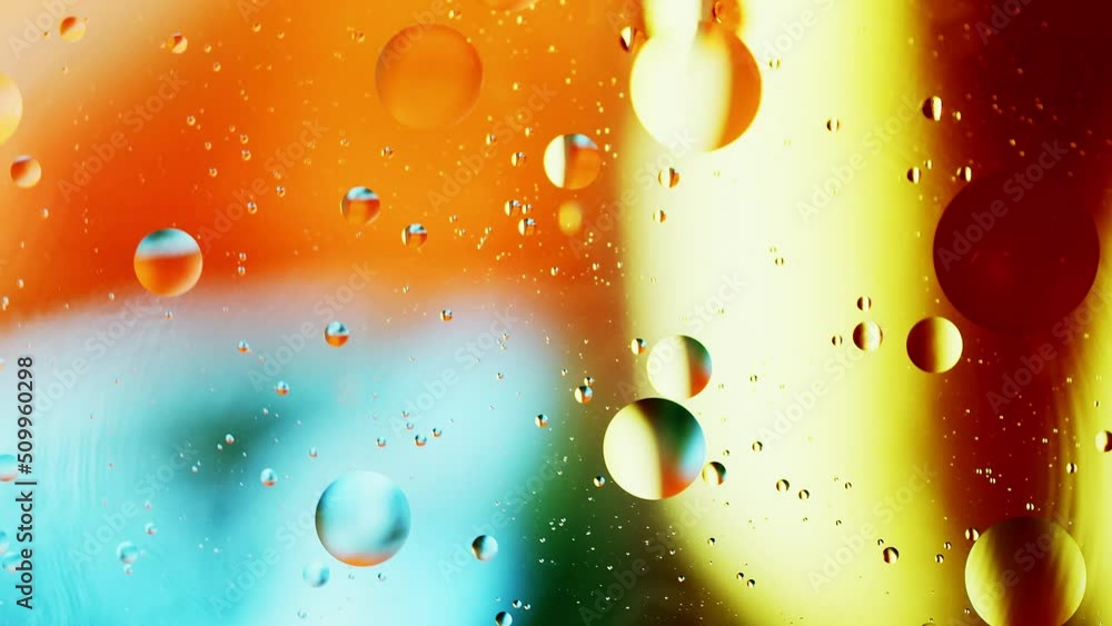Poster real close up oil bubbles in water rotation with color gradient abstract mixing background.