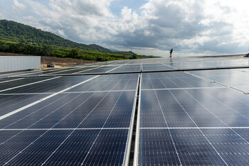 Solar power panels on the roof for green energy. Solar panels on factory roof photovoltaic solar panels absorb sunlight.