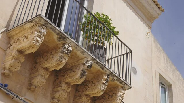 A baroque balcony in Sicily with ornamental tuff. Palazzo Nicolaci in Noto, Sicily.	
