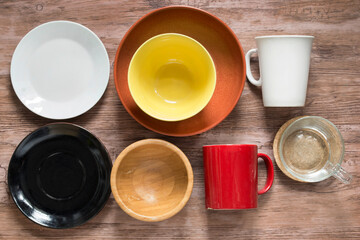 Clean tableware on wooden background