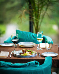 Served restaurant table with wine drinks and food
