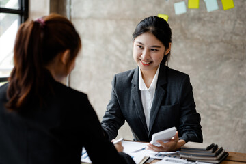 Groups of people gathered in the conference room, they were having a brainstorming meeting and planning meetings to manage the company's growth and profit. Management concept from the new generation.