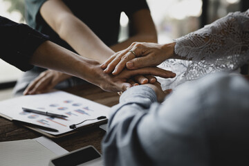 Collaboration of corporate teams, groups of people are collaborating to create positive energy in...