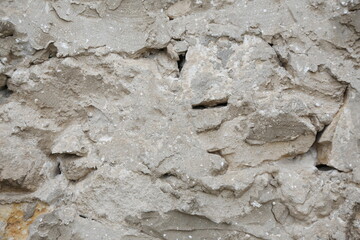 old wall made of light stone. background texture