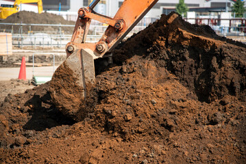 Excavator digging the ground: civil engineering work