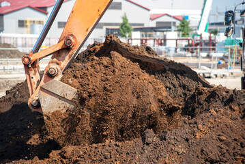 Excavator digging the ground: civil engineering work