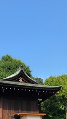 Fototapeta premium The green roof traditional shrine house of Japan, “Gojyoten Jinjya”, clear blue sky June 10th year 2022