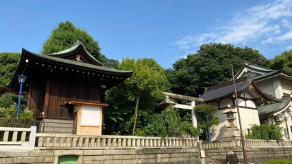 The overall house of Japanese shrine facade, “Gojyoten Jinjya” in Ueno park year 2022 June 10th sunny weekday