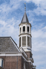 The Onze Lieve Vrouw ten Hemelopneming with white tower, better known as Elleboogkerk, was built in 1783 for one of the four Catholic stations. Amersfoort, the Netherlands.