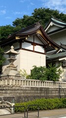 The rooftop decor and stone lantern of ancient Japanese shrine house, Ueno park 