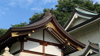 The rooftop gold emblem decor of ancient Japanese shrine house, Ueno park Gojyoten Jinjya&rdquo; temple, year 2022 sunny weekday 