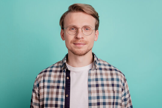 Cheerful nice concentrated guy look camera wear glasses checkered shirt isolated on teal background