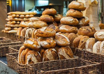 Counter with bread on the market. Fresh bread is laid out in rows.