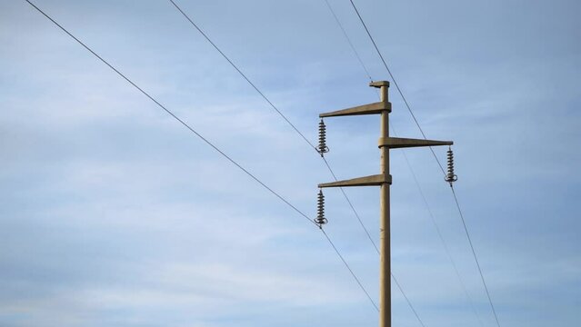 Close-up of power pole with sky in the background