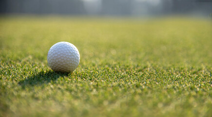 Golf ball on tee on golf course. Hobby in holiday and vacations on club golf. Lifestyle and Sport Concept