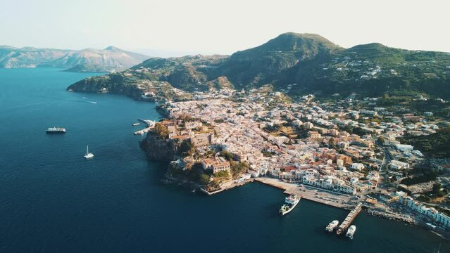 Aeolian Islands. Lipari town aerial view with drone overlooking to other islands: Hovering on Lipari city centre, Lipari's castle and Canneto's beach