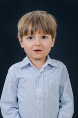 Portrait of a little boy with open mouth