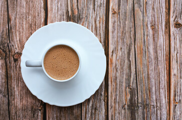 Coffee cup on wooden table.