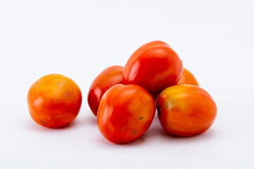 Healty fruit. Tomatoes on the white background.
