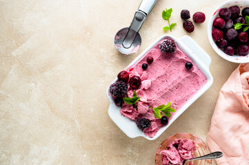 Homemade fruit, pink sorbet with banana and berry ice cream summer refresing treat, copy space - obrazy, fototapety, plakaty